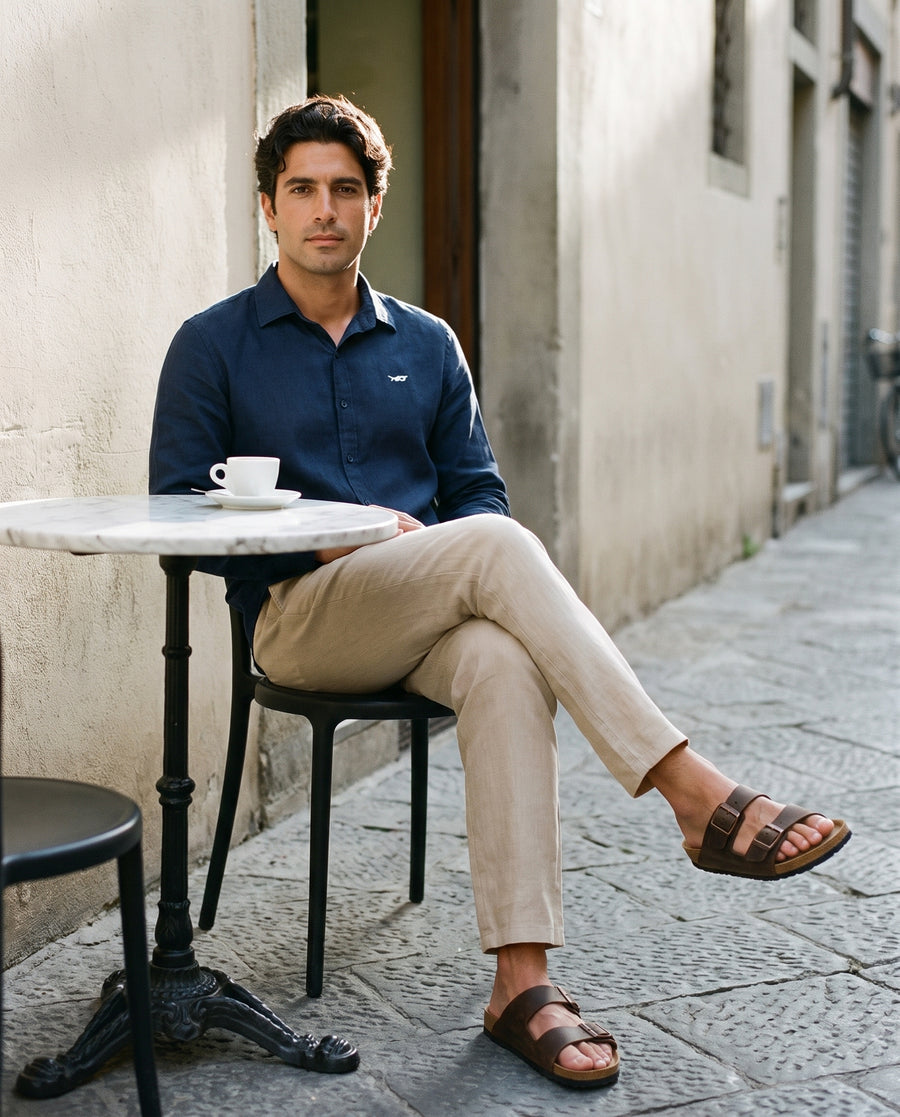 Squalo Roma linen shirt worn at an evening cafe table